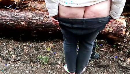 whipping her naked cunt in the woods