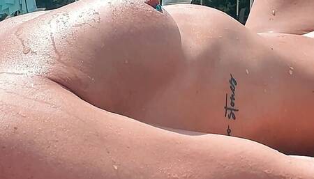 Sunbathing Nude in Public - Girl With Pierced Nipples Gets Naked by the Pool