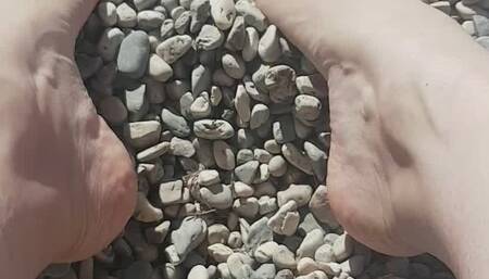 Little rocks between My toes on the beach