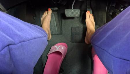 Girl driving car barefoot and pressing the pedal