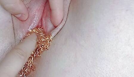 I use a gold chain to masturbate and penetrate my college stepdaughter's pink pussy until she comes