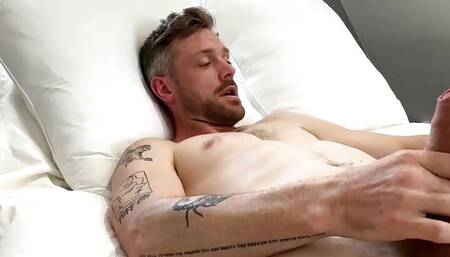Handsome guy with tattoos jerks off and gives himself a facial