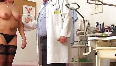Busty mature woman in her gyno examination