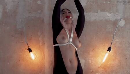 Olga in catsuit is tied to the wall and completely wetting herself in drool mobile version