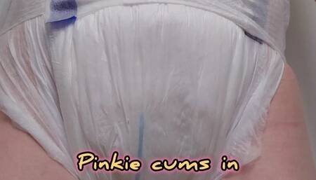 Pinkie cums in her wet diaper