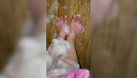 Teen's feet are caressing in foam