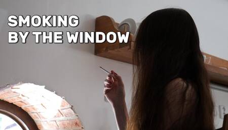 Smoking by the window