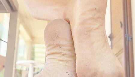 Dirty soles under the chair