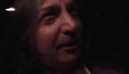 Sissy CD in a night time solo car masturbation scene.