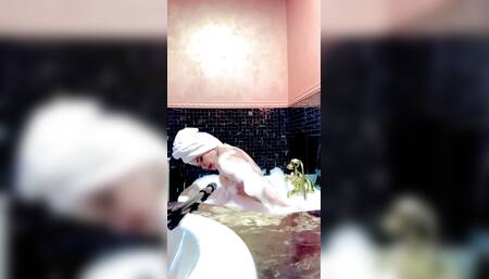 Stepmom Takes A Bath And Plays With Her Big Tits