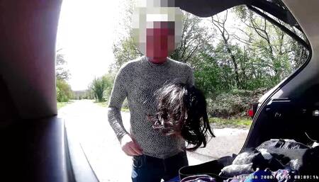cross dress changing in public car park as cars drive past