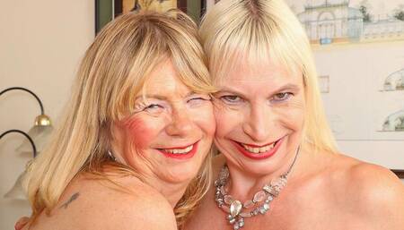 Elle and Barby are enjoying lesbian sex on the black sofa