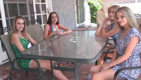 Four skinny babes are playing a strip game in the garden with their male friend