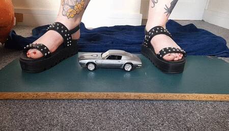 Giantess Jayne crushes a Pontiac Firebird in chunky sandals toy car crush closeup ground view