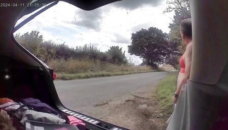 Cross dress in red knickers and bra changing as cars drive past
