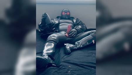 The rubber man enjoys and the big cock is hard as a rock