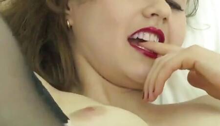 Tina Kay masturbates in bed wearing stockings