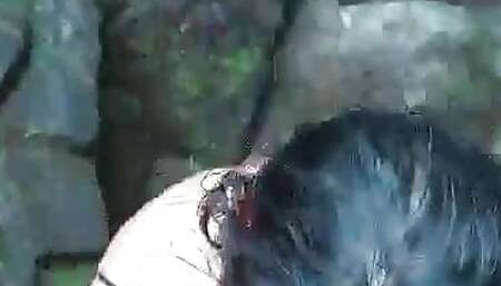 teenage freak gives head by waterfall