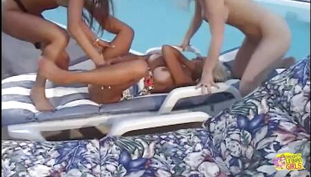 Three Kinky Cuties Bring a Strapon by the Pool to Enjoy a Steamy Lesbian Threesome