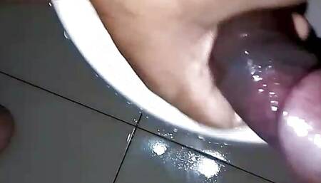 Horny hunk punish his oiled up black dick in bathroom until cum.