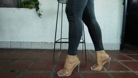 A beautiful lady crossing her legs and with beautiful high heels dangling (2)