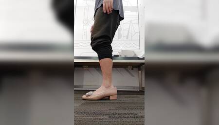 Trying on beige women's shoes