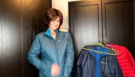 Zippering Down Jackets From Black Garment Bag