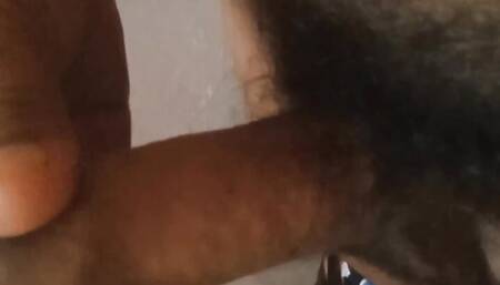 A man is masturbating and moaning in a public bathroom