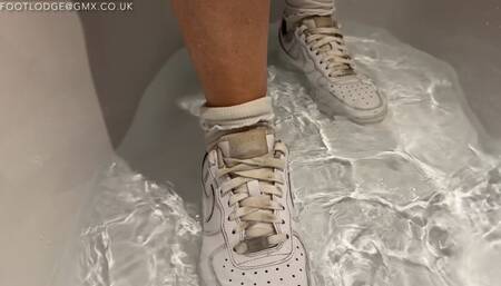 Getting my white socks and Nike sneakers soaking wet in the bath