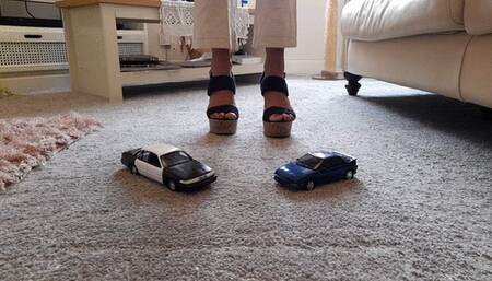 GIANTESS Charn crushes a Ford Crown Victoria police toy car & an old Toyota in chunky high heels closeup ground view