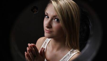 Big-boobed blonde Chloe Addison gives a blowjob in the gloryhole