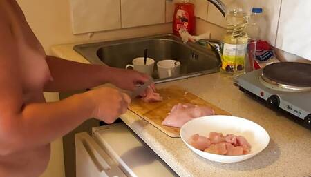 Zara is cooking topless in the kitchen