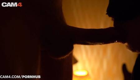 Amateur babe sucking and jerking cock by candlelight