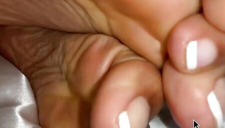 Ebony Girl Under Her Covers in Bed Show off Feet