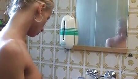 A pretty blonde German babe rides dick in the car