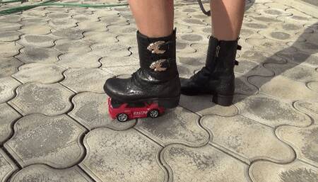 Crushed a toy car with black boots C