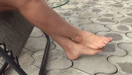 rubs feet crossed at the ankles 18BF