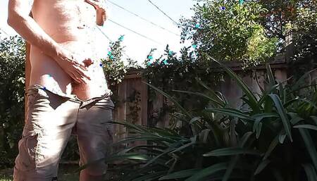 In my backyard with cargo shorts slipping off