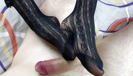 Girlfriend caresses dick with her feet in black socks and does the best handjob in oil