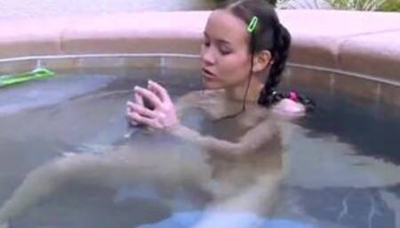 Tiny Tabby Masturbating her pussy using dildo at the pool