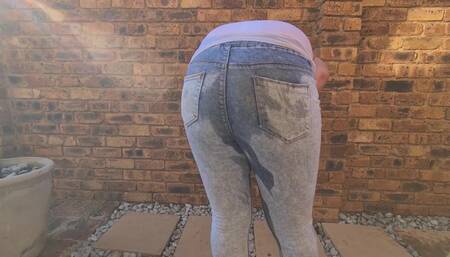 Brunettes outdoor piss, soaking clothes in piss, pants wetting