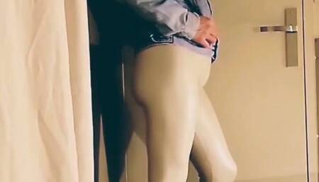 Arousal in white vinyl leggings
