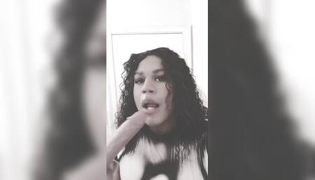 Ebony trans sucking her new dildo