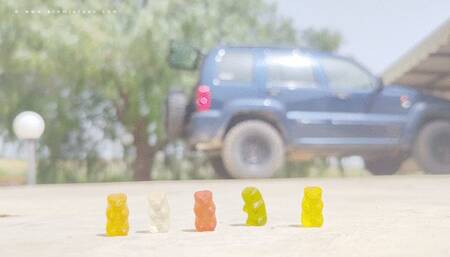 Giantess and gummy bears specks under her feet