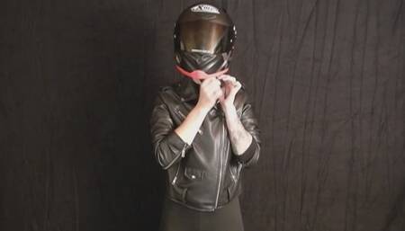 Sophia tries on the right size motorcycle helmet