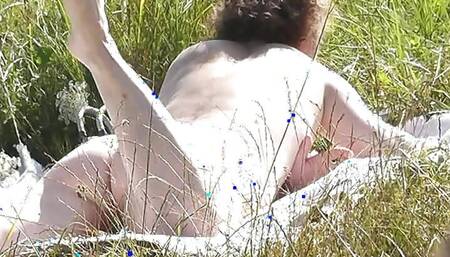 Nude Milf sunbathing on river bank. Random guy watching. Wild beach. Nudist beach. Naked in public. Doggystyle. Ass. Pussy. POV
