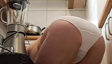 mom cleaning the kitchen on all fours