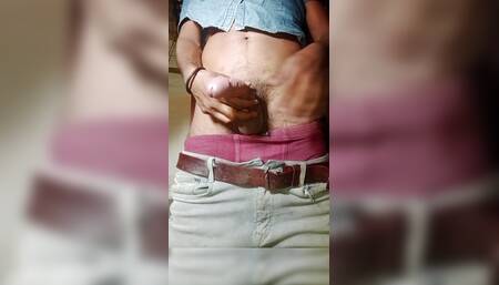 How does Dharmendra hit his fist in private?