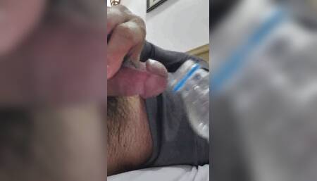 Ejaculation in a plastic bottle