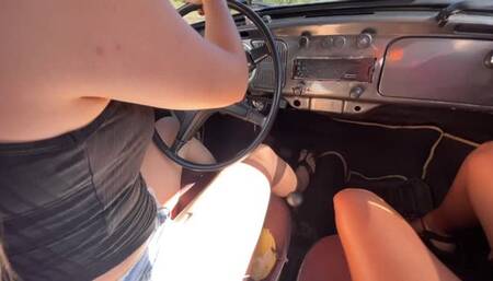 Jarlyn has fun driving barefoot on the highway with her co-pilot friend